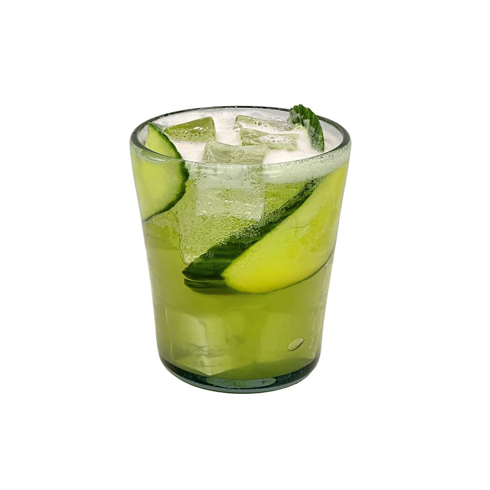 Green glass of Atmosphere 0.0 Pils based Margarita with cucumber slices and ice on a white background.